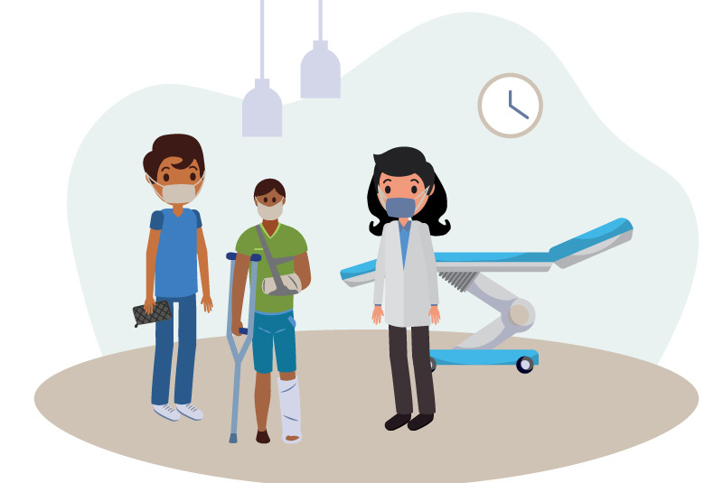 A physician talks with an injured child and their parent in an emergency room.